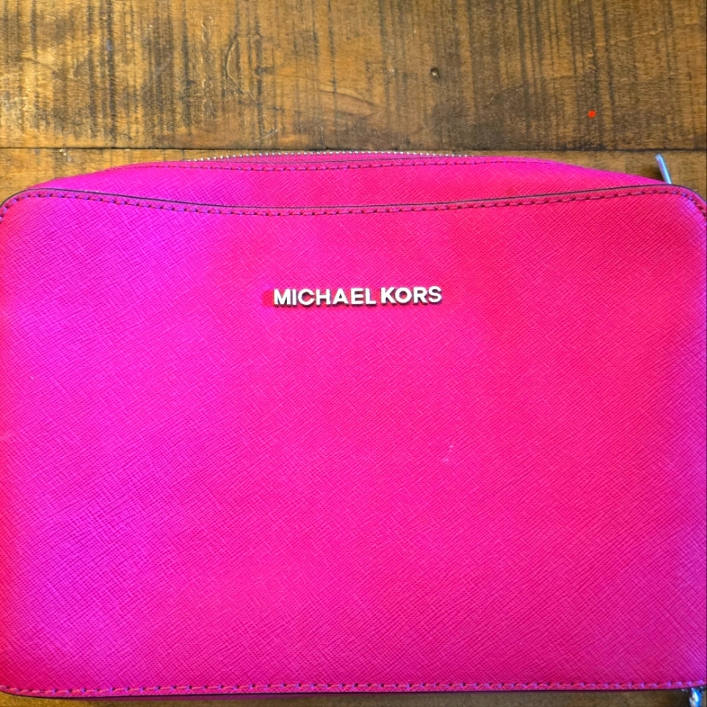 Hot pink Michael Kors crossbody purse with silver detailing
